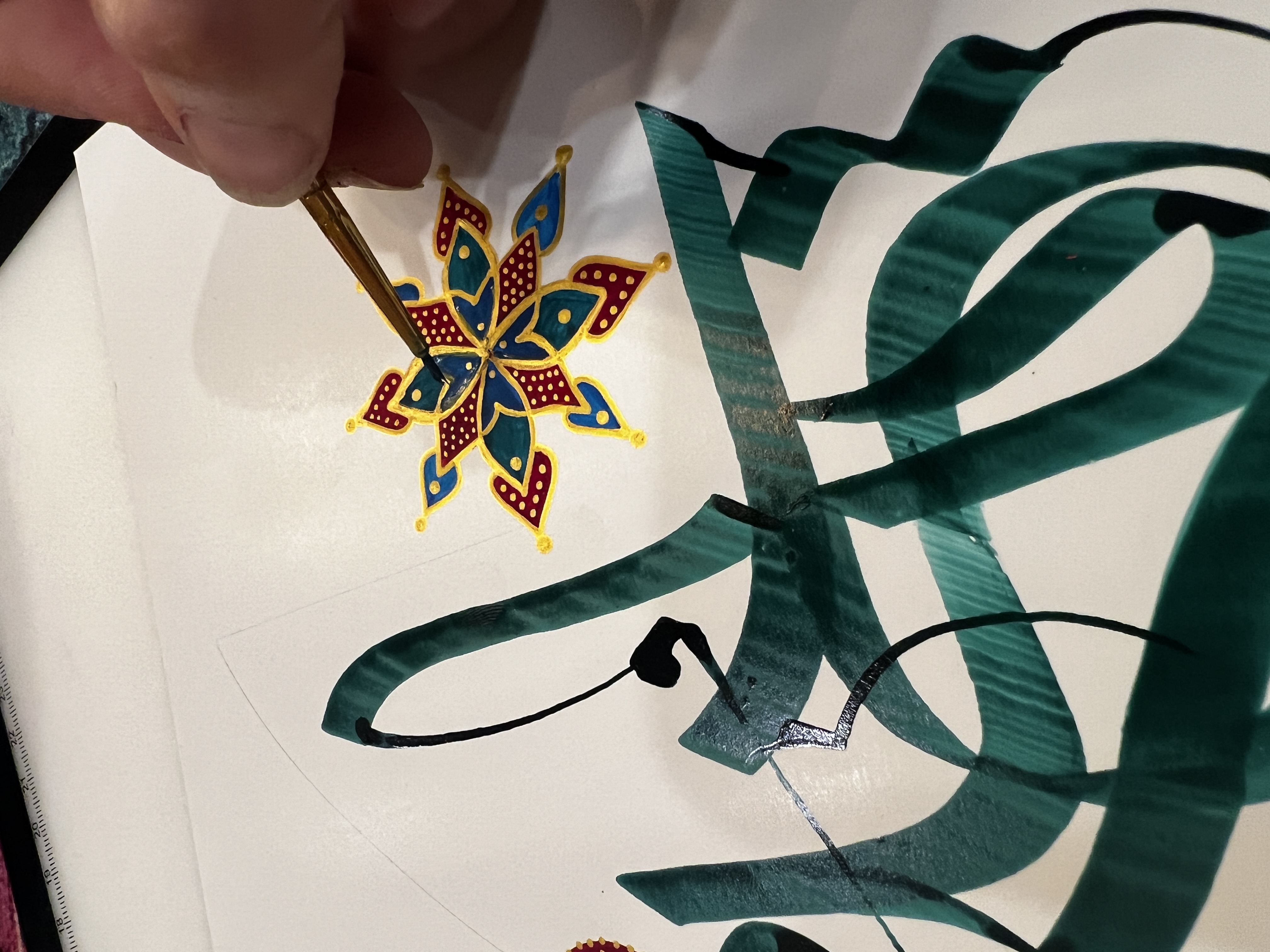 Detail of illuminated floret being painted